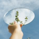 a person holding a mirror